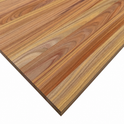 Close-up of a Canary hardwood panel showing golden, reddish-brown, and tan grain patterns with a visible square corner.
