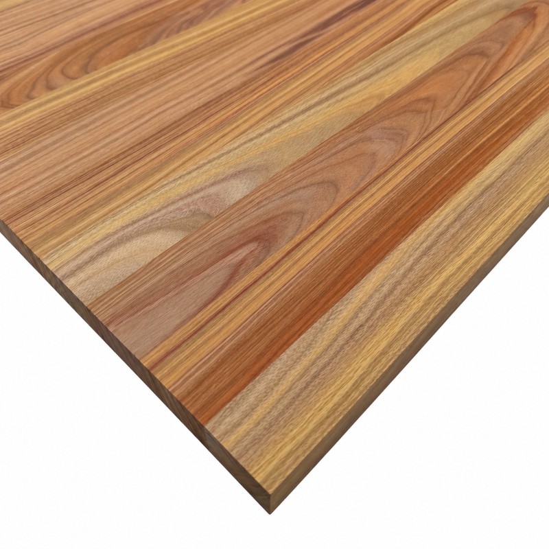 Close-up of a Canary hardwood panel showing golden, reddish-brown, and tan grain patterns with a visible square corner.