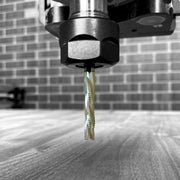 Golden girl bit in the Cnc with a board underneath 