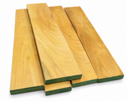Four wooden osage orange planks on a white background