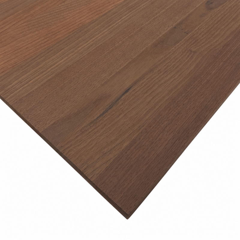 Close-up of a Peruvian walnut wood panel showing its brown tones, grain patterns, and unfinished surface.